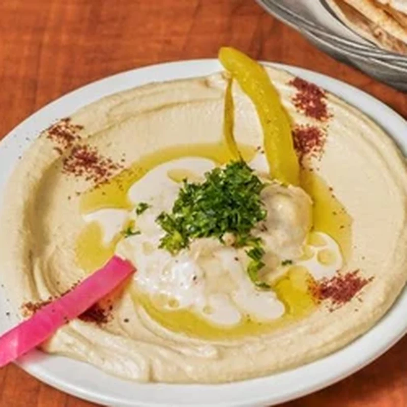 Falafel platter topped with hummus, salad and pita at King's Restaurant